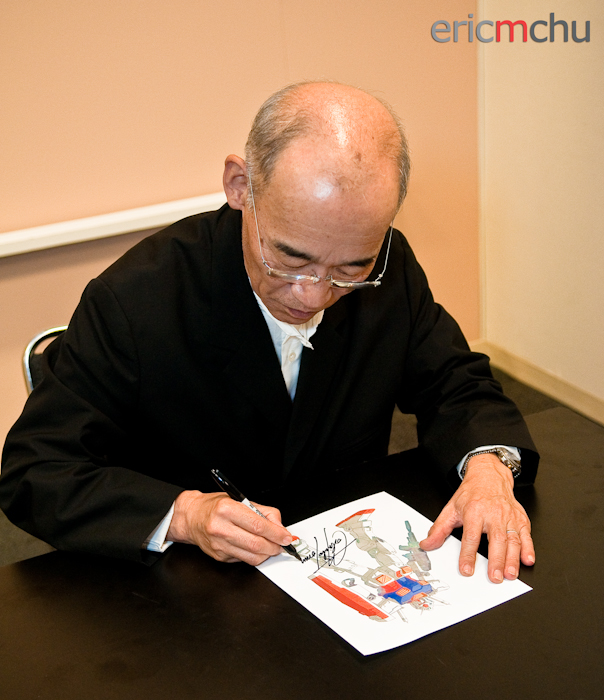 Tomino signing a sketch of the R78 Gundam. Photography by Eric M Chu.